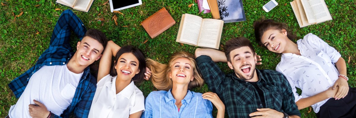 Students life. Low angle view of cheerful young people communica